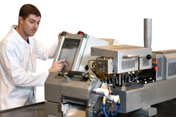 Coperion engineer working on Baker Perkins MPX19 Extruder