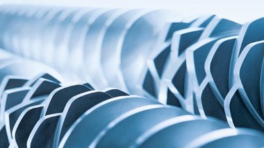 Coperion twin screw extruder screw elements lined up on screw shaft