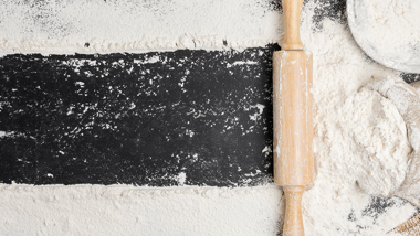 Flour on a work surface with a rolling pin